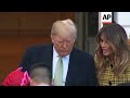 Trump and First Lady hand out Halloween candy to children at White House