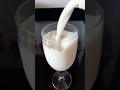 Pouring Fresh Milk Into a Cylinder wine Glass#drinkingmilk #satisfyingvideo #freshmilk,#wineglass