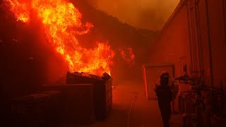 Wildfires race across Southern California; tens of thousands evacuated