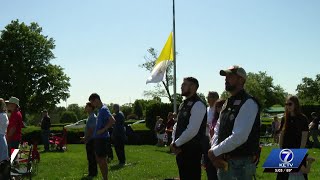 Families gather at Calvary Cemetery to honor the fallen