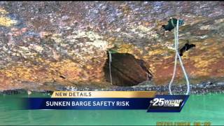 Environmental officials release new details about sunken barge