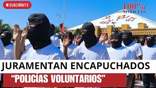 Paramilitares encapuchados juramentados como \