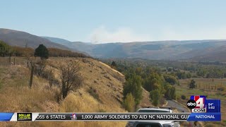 Firefighters camp near the scene of the human-caused Yellow Lake Fire