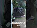 Surveillance video shows porch pirate in California use trash bag during theft