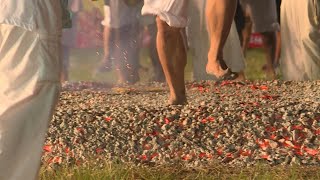 Devotees walk on burning coal during Phuket vegetarian festival | AFP