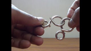 Solution to 8 shaped Metal Ring puzzle