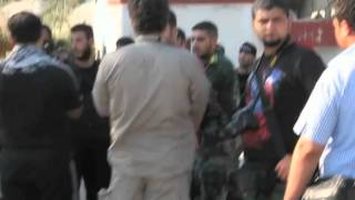 Two Brothers Wage Media War for Syrian Rebels