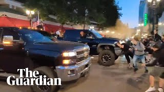 Trump supporters drive through crowd and pepper spray protesters in Portland