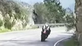 Motorcycle flips over cliff in scary crash caught on tape