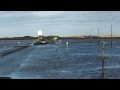 Car going through water at Holy Island causeway