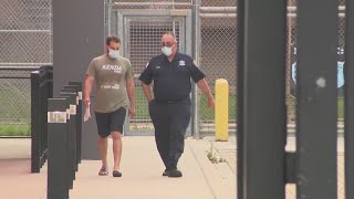 Iowa man facing weapons charges post bond, exits jail, later proposes