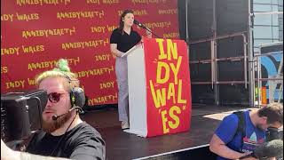 Mirain Angharad Owen from Cymdeithas yr iaith adresses the rally in Swansea