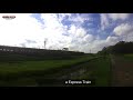 rajarata rajina express train passing a beautiful paddy field sri lanka railway