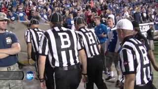 Fans at BYU-Utah game shower referees with debris as they leave field