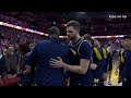 michigan hc juwan howard punches wisconsin asst. coach and fights break out.