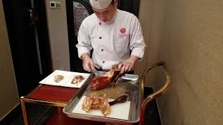 Traditional Peking duck carved tableside