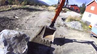 Hitachi EX75 UR moving a too big stone