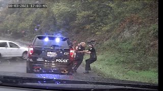 Virginia policeman saves fellow officer from oncoming car
