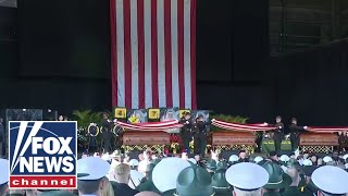 President-elect Donald Trump pays his respect to fallen deputies