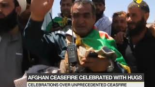 Taliban militants, Afghan soldiers celebrate ceasefire with hugs