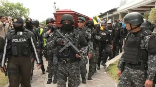 Coffin of murdered Ecuador candidate transported to cemetery church | AFP