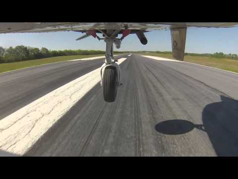 How does a shimmy damper keep a nosewheel from shimmying?