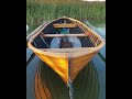 woodenboat idling in dock.