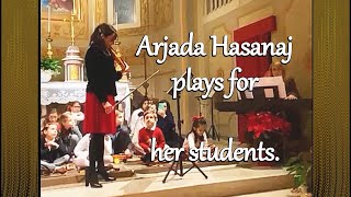 Arjada Hasanaj plays for her students \