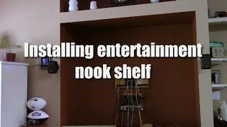 Installing a shelf in our entertainment nook