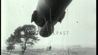 An observation balloon is berthed by soldiers in France during World War I HD Stock Footage