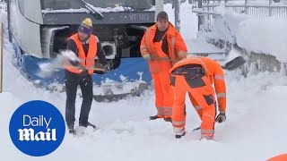 Germany digs out after heavy snowfall causes travel chaos