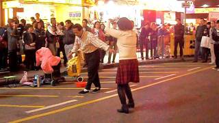 Old man dancing in Mongkok, Hong Kong