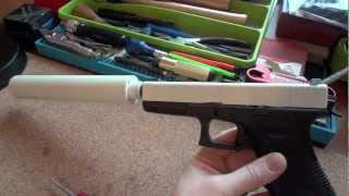 Glock 17 9mm and YHM Suppressor with Bright White Cerakote