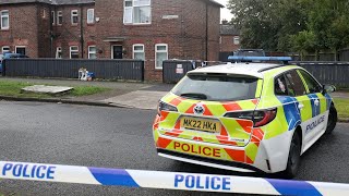 Floral tributes laid by house where mum and girl, 8, found dead | SWNS