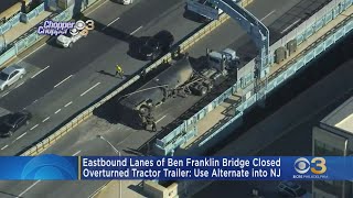 Overturned tractor trailer stops traffic on Ben Franklin Bridge.