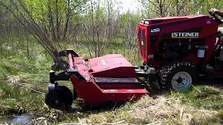 Steiner 450 and Rough Cut Mower Attachment Leveling Heavy Brush