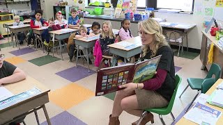 Chelsea Strub reads to kids in the Wyoming Area School District