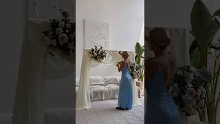 Draping a backdrop with 3 chiffon panels, pool noodles, and artificial flowers 🤍