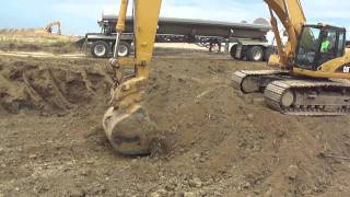 Caterpillar 345CL Excavating and Loading SideDumps on a Earth Moving Project In Troy, IL.