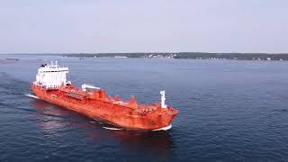 Aerial ship chasing on the st Laurence river in thousands island national park.