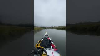 Wooden kayak in Alaska on a foggy day