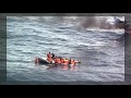 portuguese air force rescues migrants from burning boat