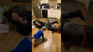 Mother and daughter play wrestling in the kitchen 🤣