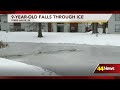 nine year old boy falls through the ice on a frozen pond at an indiana apartment complex