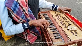 An absolute harmonium player at Darjeeling || beautiful harmonium playing of a beggar .