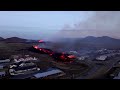 drone footage of molten lava burning iceland houses