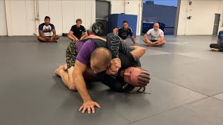 Getting to the shoulder crush sweep from half guard by Sloan Clymer