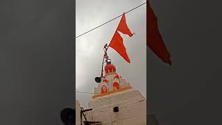 see the monkey on the  Hanuman temple playing the flag