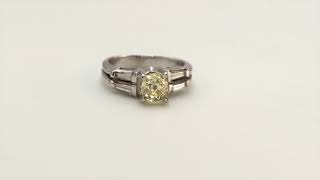 Art Deco Fancy Yellow Diamond Platinum Solitaire Ring With Baguette Shoulders