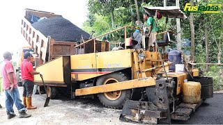 Asphalt Paver Sumitomo HA40W And Dump Truck Working